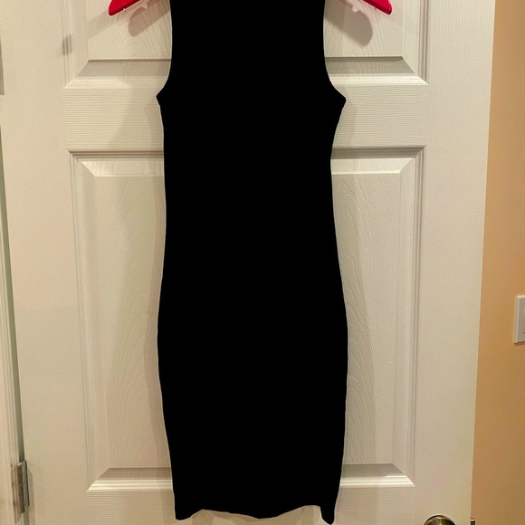 Black slightly below the knee dress by Guess with a silver chain style front. - Picture 5 of 5